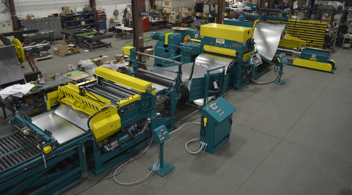 SLEAR, Econo, Econo Slear, EconoSlear, Econo SLEER, multi-blanking, multi-blanking system, mbl, slitting, slitter, slitter arbor, slitter blades, slitter blade access door, cut-to-length, CTL, stock reel, uncoiler, drop-in uncoiler, multi-coil uncoiler, coil reel, payoff reel, motorized uncoiler, powered uncoiler, coil car, coil loading car, coil loading & storage car, straightener, powered stock straightener, stock straightener, metal coil straightener, peeler table, peeler/threader table, peeler blade, leveler, existing leveler, retrofitted leveler, leveler retrofit, flying shear, flying cutoff, cutoff shear, motorized flying shear, traveling shear, touchscreen, touchscreen HMI, autostacker, stacker, drop stacker, sheet stacker, separator plates, separators, multi-blank stacker, lift table, stack table, runout conveyor, roller conveyor, stack conveyor